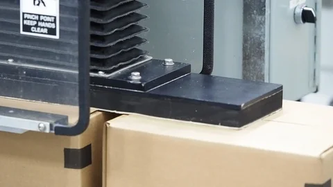 Carboard boxes. Closed by hydraulic press machine Stock Footage 101975868