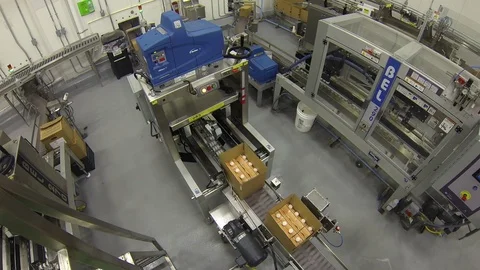 Carboard boxes. Closed by machine in plant. top down Stock Footage 102185345