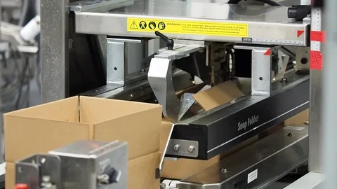 Carboard boxes. Folded by machine in plant A Stock Footage 102185279