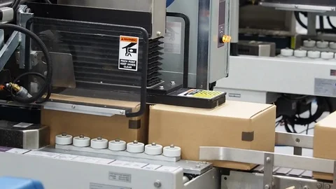 Carboard boxes. Folded by machine in plant. pan Stock Footage 102185306