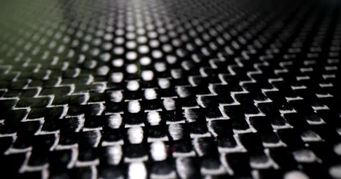 Carbon fiber surface features repeating geometric pattern Stock Footage 308878193