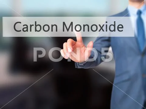 Carbon Monoxide - Businessman press on digital screen. Stock Photos