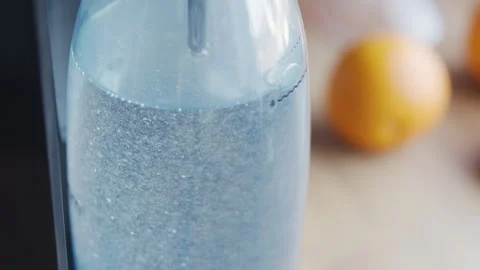 Carbonated drink with bubbles in a transparent bottle. Stock Footage 331856602