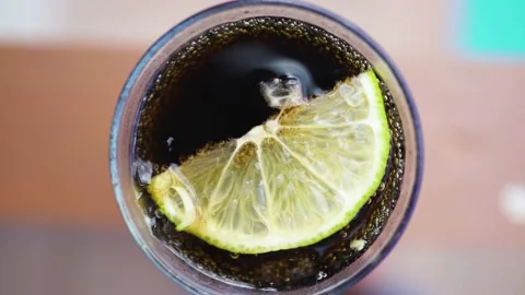 Carbonated lemonade with a slice of lemon Stock Footage 153540555