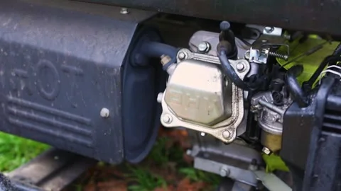 Carburetor and engine of portable generator vibrating while running Stock Footage 321803369