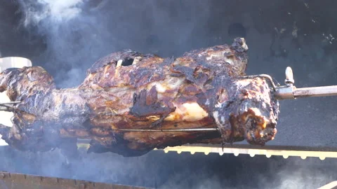 Carcass of ram is fried on spindle. Stock-Footage 152342833