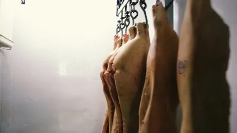 Carcass Of Raw Meat Beef Pork Hanging On Hooks In The Freezer To Production. Video stock 169171468