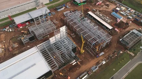 Carcasses for workshops and cranes at construction site Stock Footage 138207194