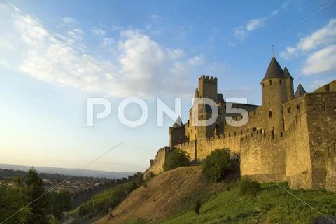 Carcassonne in golden sunlight Stock Photos