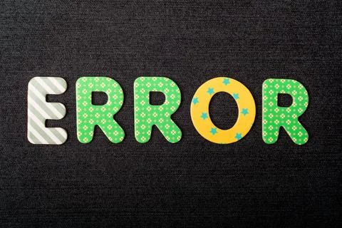 Card with Error word made from mixed vivid colored wooden letters on a textur Stock Photos