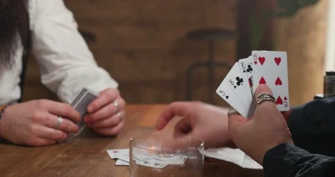 Card game in a pub, hands of two males Stock Footage 103932182