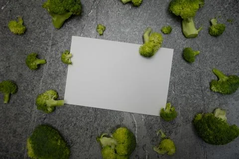 Card message with pieces of broccoli in background Stock Photos