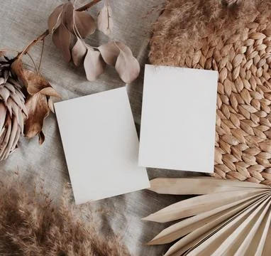 Card mockup empty blank paper and dry flowers in boho style background top view  Stock Photos