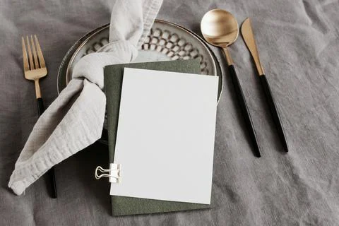 Card mockup on table place setting neutral gray color linen tablecloth backgroun Stock Photos