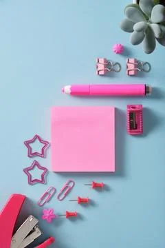 Card with pink post-it notes and office supplies stapler, paper clips, shar.. Stock Photos