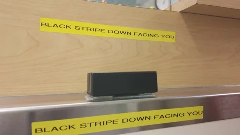 Card reader at retail counter with black stripe down facing you sign Stock-Footage 331986342