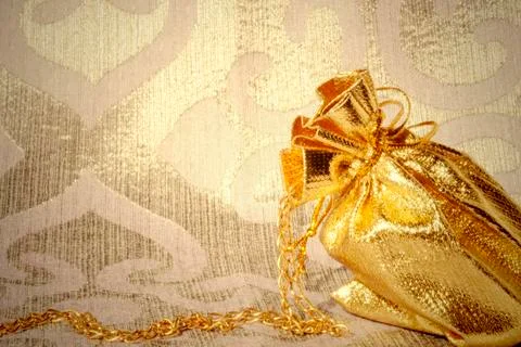 Card, sack with gold jewelry Stock Photos