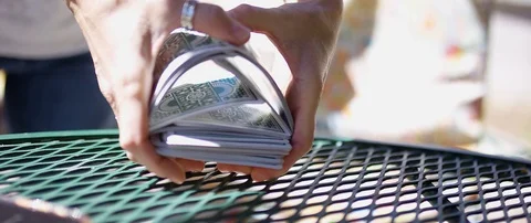 Card Shuffle Outside Patio Bright Sunny Sequence Game RED Dragon 6k 100fps Stock Footage 88752121