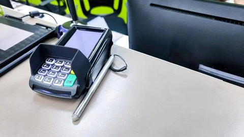 Card swipe machine to pay for products to the shop. Stock Photos