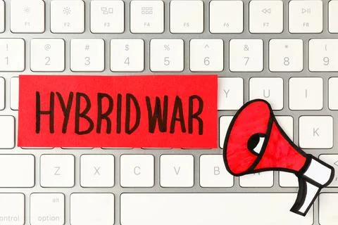 Card with words Hybrid War and paper megaphone on computer keyboard, top view Stock Photos