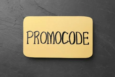 Card with words Promo Code on black background, top view Stock Photos