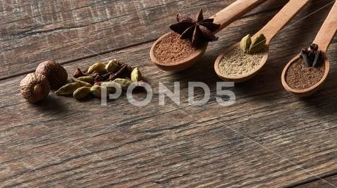 Cardamom, cloves, nutmeg, star anise, allspice. Stock Photos