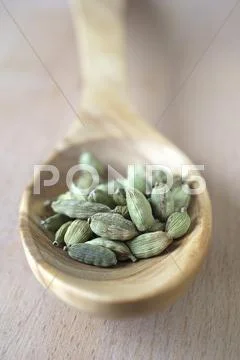 Cardamom Pods On A Wooden Spoon