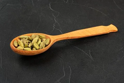 Cardamom in spoon Stock Photos