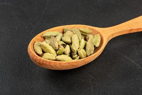 Cardamom in spoon Stock Photos
