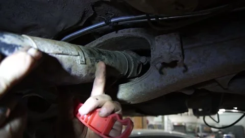 Cardan shaft a mechanic disassembles an old Stock Footage 221433723