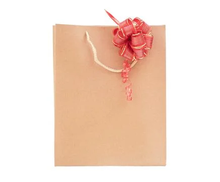 Cardboard bag with bow isolate. Stock Photos