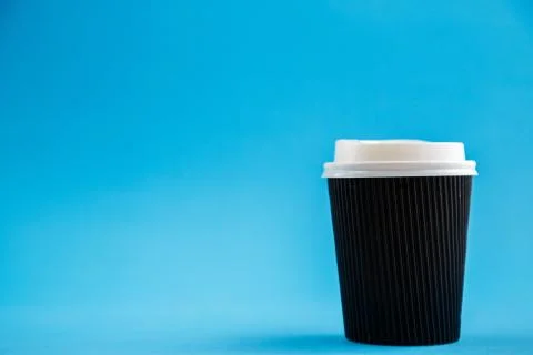 Cardboard biodegradable eco-friendly cups on a blue isolated background Stock Photos