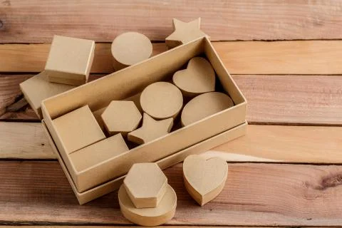 Cardboard biodegradable eco-friendly gift boxes on wooden background Stock Photos