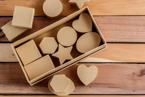 Cardboard biodegradable eco-friendly gift boxes on wooden background Stock Photos