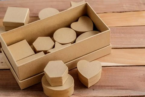 Cardboard biodegradable eco-friendly gift boxes on wooden background Stock Photos