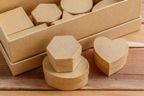 Cardboard biodegradable eco-friendly gift boxes on wooden background Stock Photos