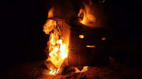 Cardboard box burning in fire Stock Footage 68655595