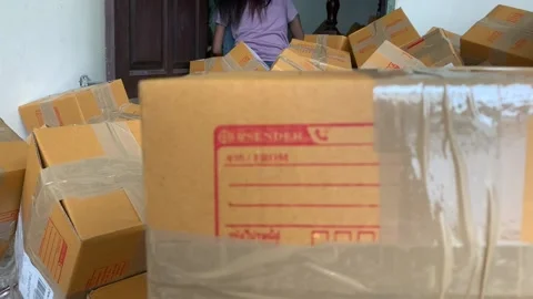 Cardboard box package sender and postcode Thai word screen on parcel Stock Footage 225125019