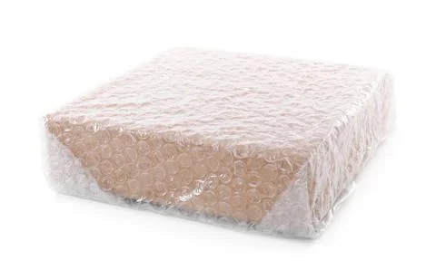 Cardboard box packed in bubble wrap isolated on white 스톡 사진