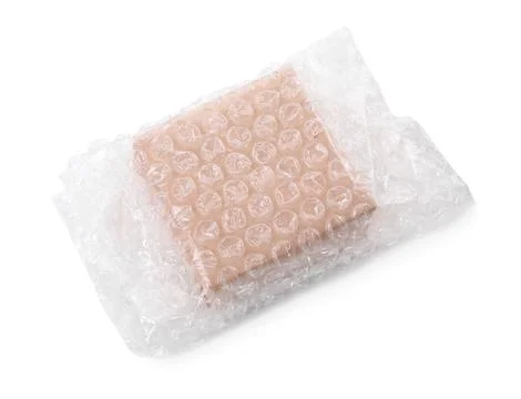 Cardboard box packed in bubble wrap isolated on white, above view Foto stock