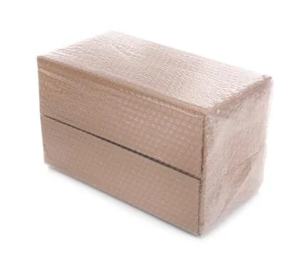 Cardboard box packed in bubble wrap isolated on white Stockfoto's