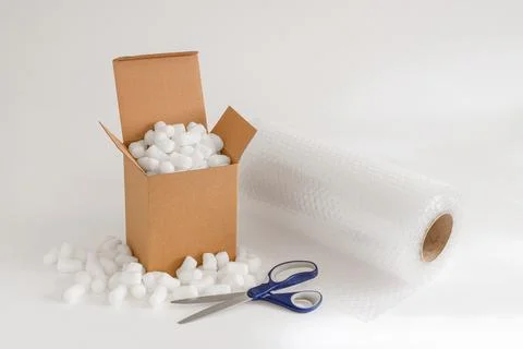 Cardboard box with packing peanuts Stock Photos