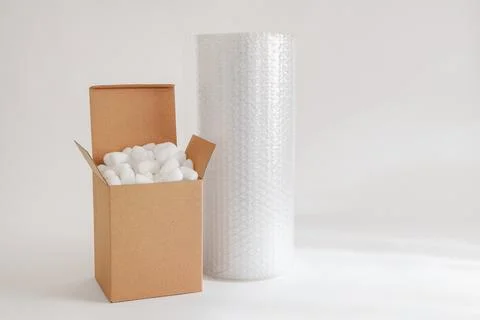 Cardboard box with packing peanuts Stock Photos