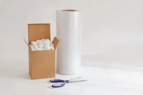 Cardboard box with packing peanuts Stock Photos