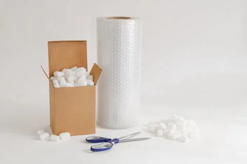 Cardboard box with packing peanuts Stock Photos