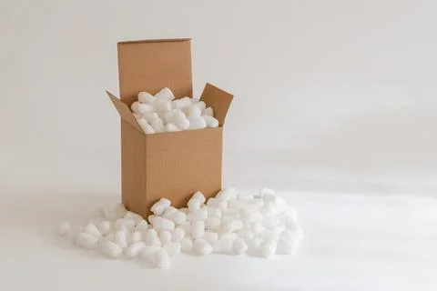Cardboard box with packing peanuts Stock Photos