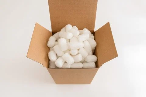 Cardboard box with packing peanuts Stock Photos