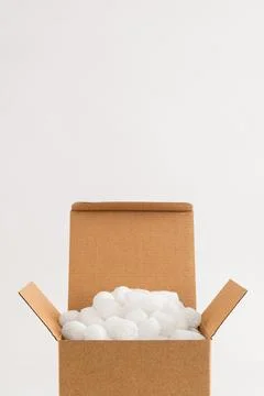 Cardboard box with packing peanuts Stock Photos