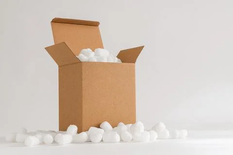 Cardboard box with packing peanuts Stock Photos