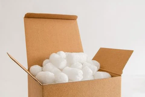 Cardboard box with packing peanuts Stock Photos